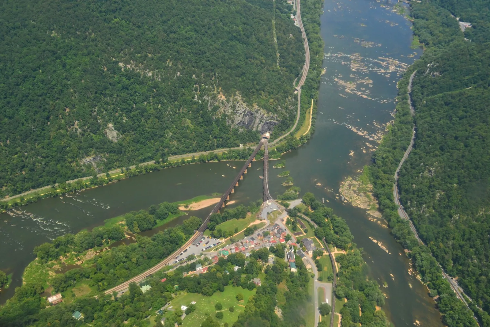 An aerial view of Harpers Ferry, its bridges, and the meeting of the Potomac and Shenandoah rivers.